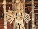 Kathmandu Changu Narayan 08 A Multi Armed Tantric Deity Carved In Wood On The Roof Strut On The South Side Of Changu Narayan Temple The roof strut on the south side of the Changu Narayan Temple in Kathmandu has an intricate carving of a multi-armed Tantric deity.